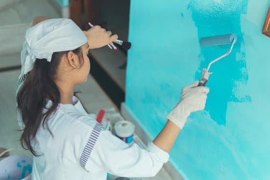 Photo of a person smiling while working from home, illustrating how to improve morale from working from home