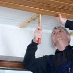 Wilson peeking over fence on Home Improvement